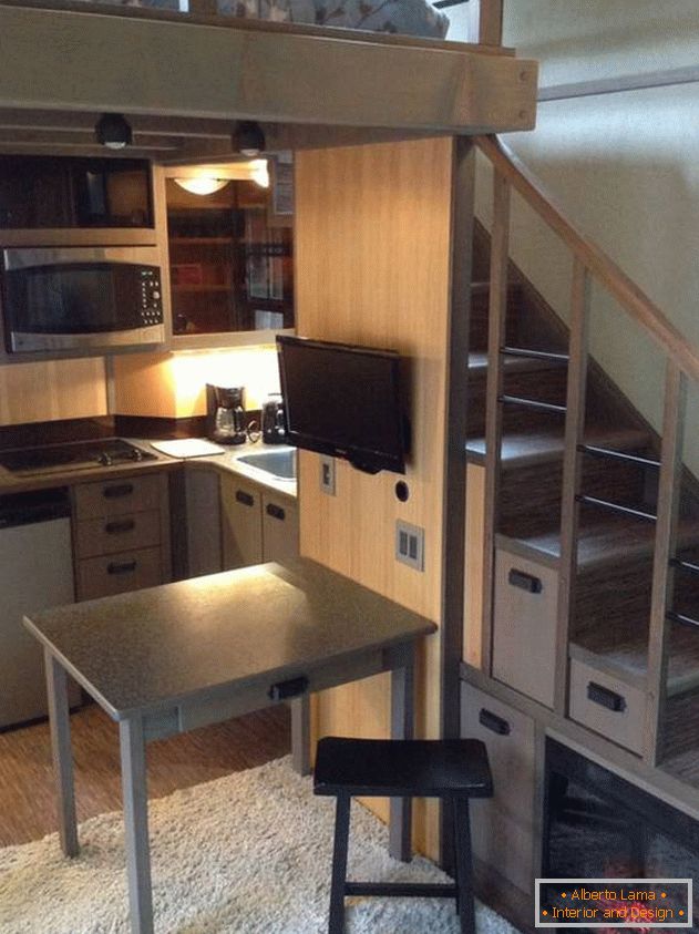 Kitchen under the stairs in a small Japanese house