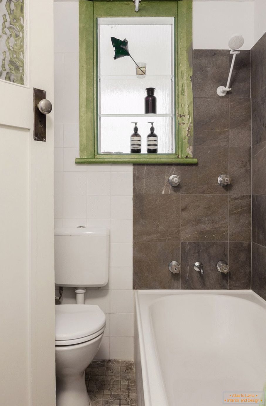 Green accents in a black and white bathroom