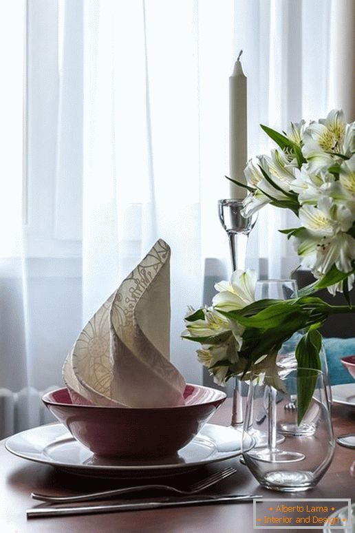 Served table in the kitchen with the effect of optical illusion