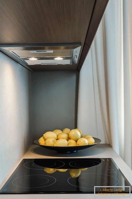 Lemons near the stove in the kitchen with the effect of optical illusion