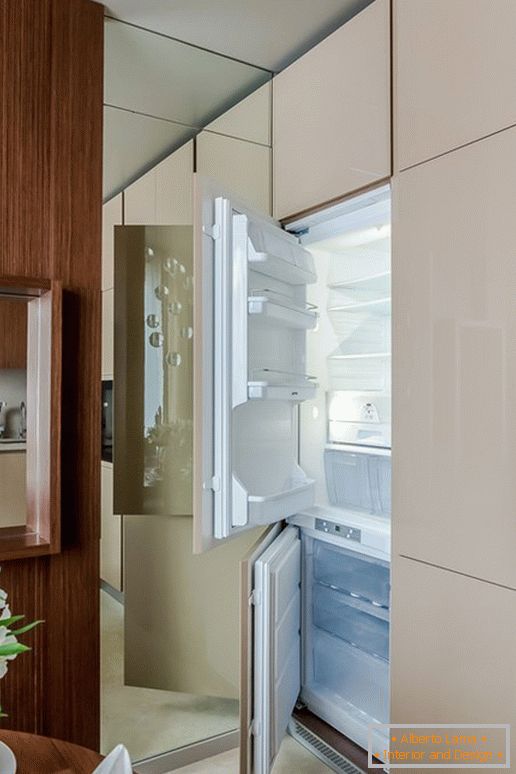 Refrigerator in the kitchen with the effect of optical illusion
