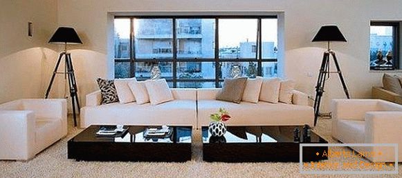 Black coffee tables in the white living room