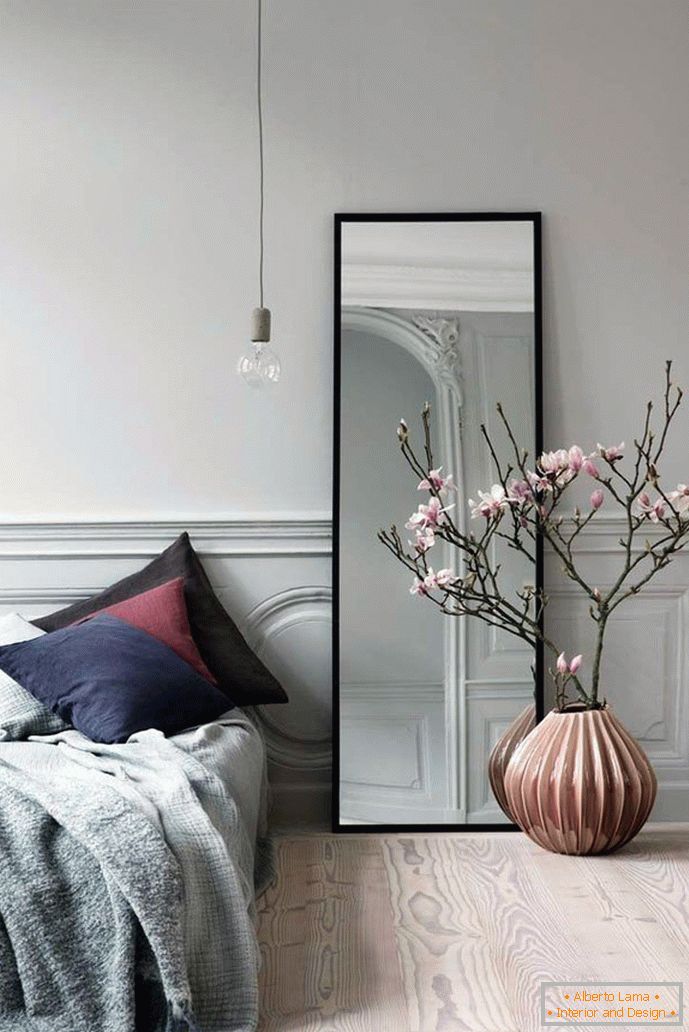 Low vase in the interior of the bedroom