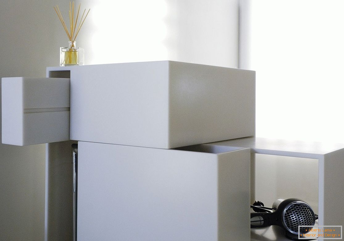 Interesting design of the locker of white color at home