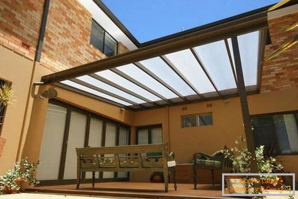 prefabricated polycarbonate awning in the courtyard of a private house, photo 19