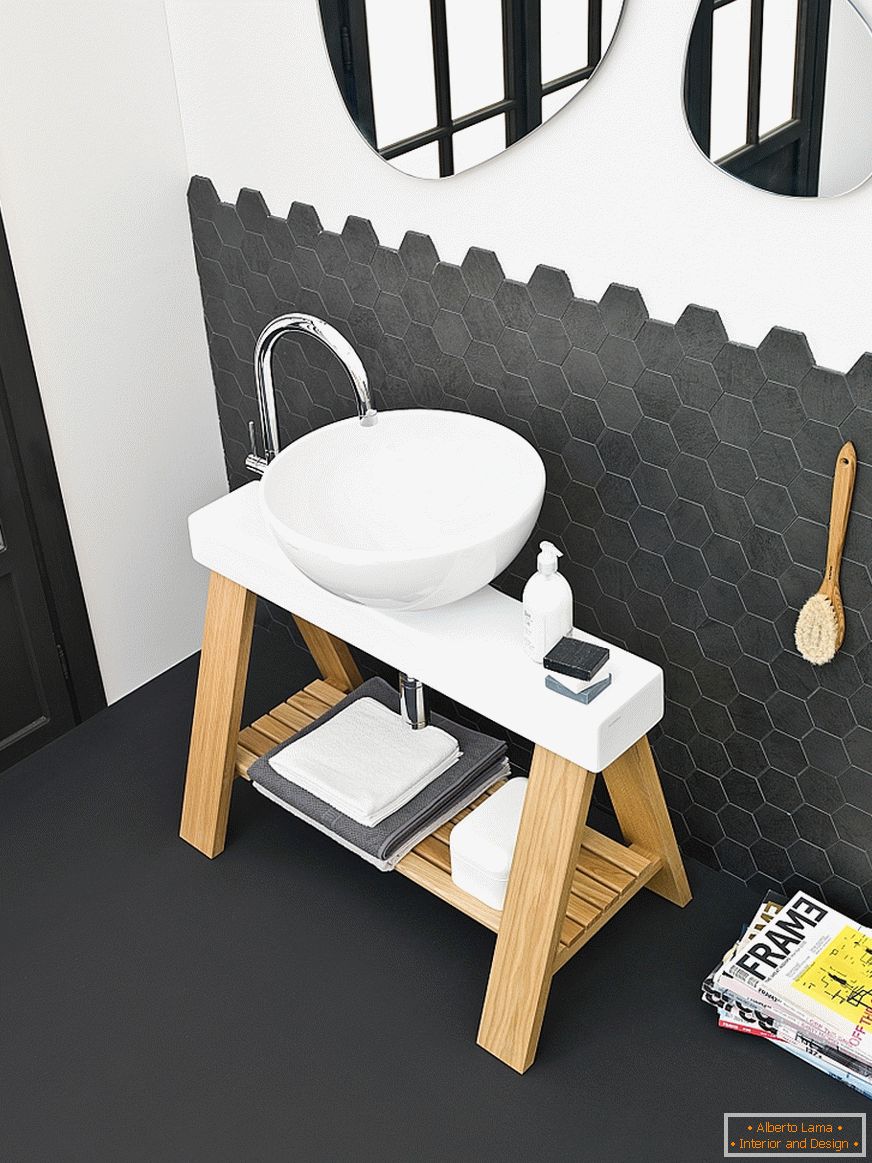Washbasin on a stand in the interior of a small bathroom
