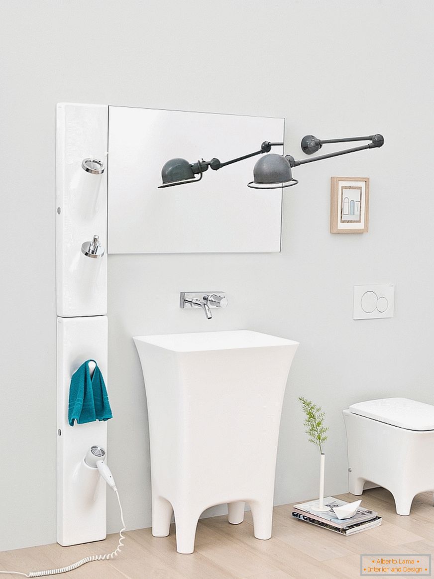 Washbasin on the legs in the interior of a small bathroom