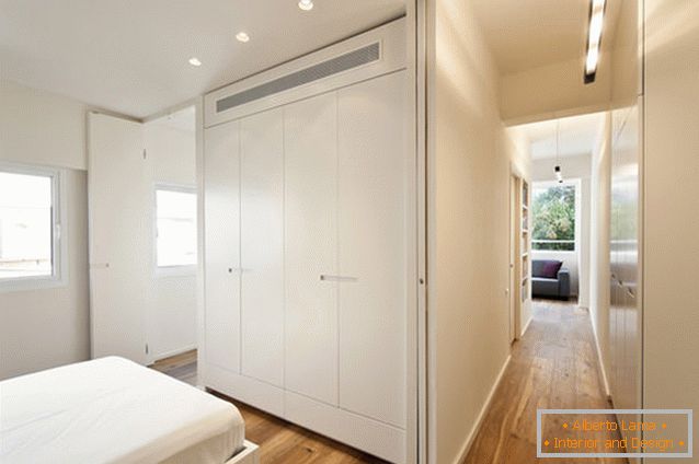 Bedroom of a rectangular studio apartment in Tel Aviv