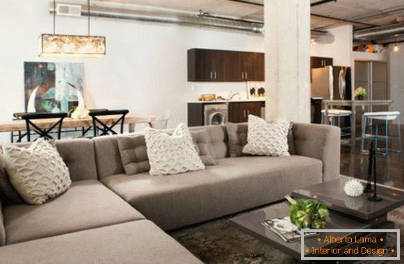 Strict corner sofa in studio apartment