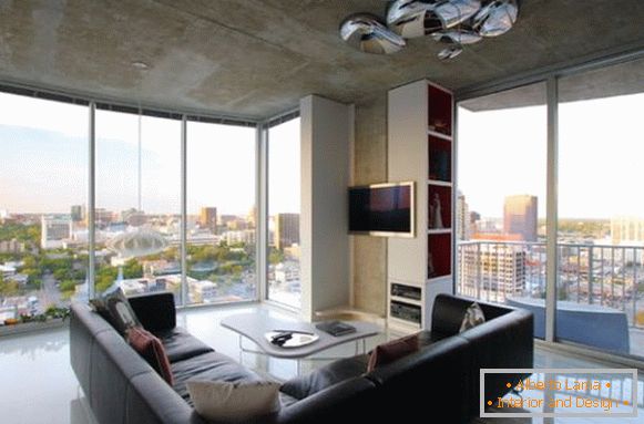 Black sofa in the living room with a luxurious view