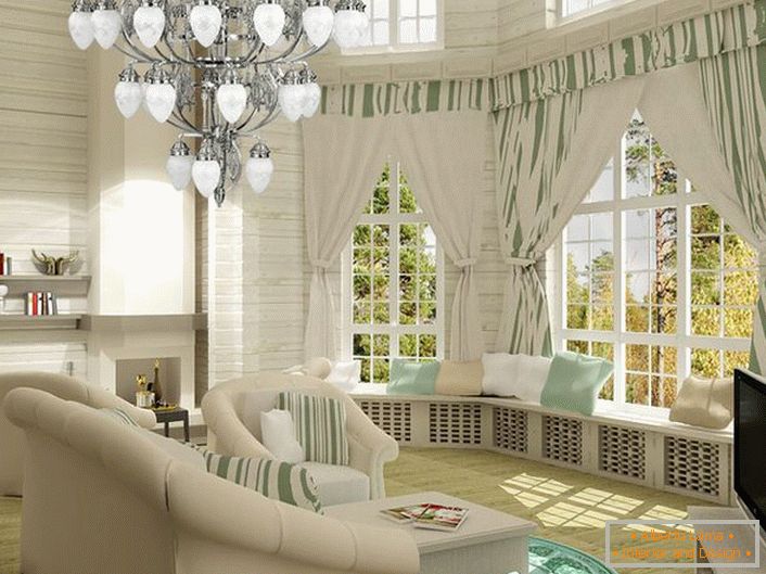 Bright living room in neoclassic style. Cozy and at the same time functional space. Of particular interest are the wide sills decorated with pillows.