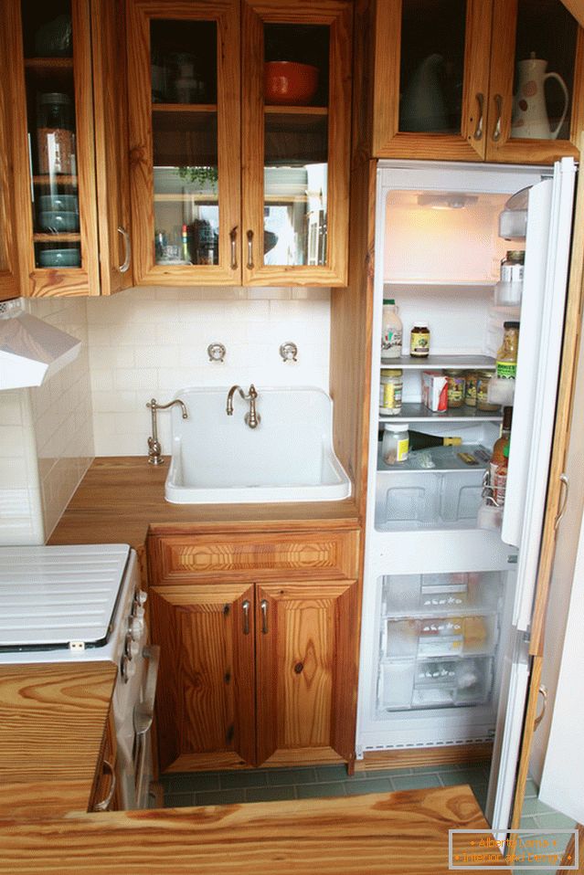 The hidden refrigerator in the interior of the vintage kitchen