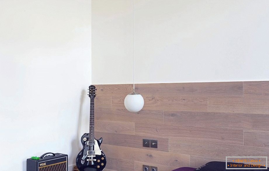 Electric guitar in the corner near the bed