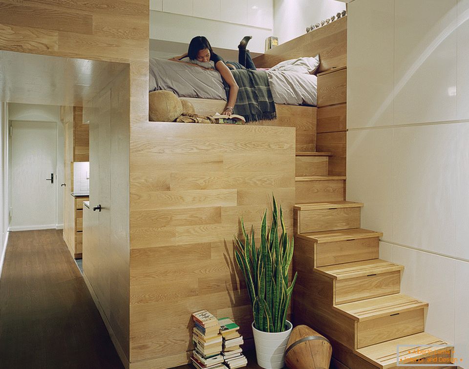 Two-level bed in the studio apartment