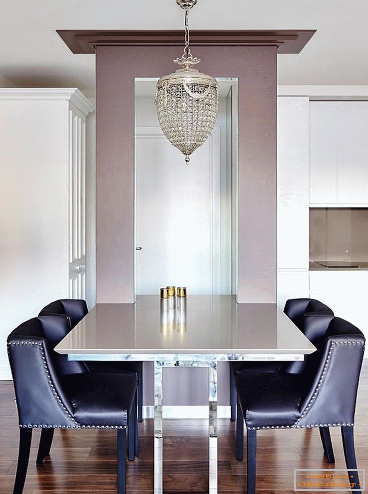 Leather armchairs and dining table in the dining room
