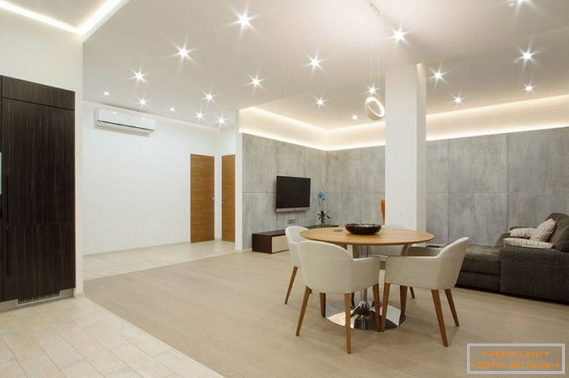 Dining room lighting in a spacious one-room apartment