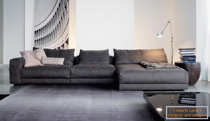 Cozy modular sofas for the interior of the living room in the style of minimalism. Baggy modular designs smoothes the rigor of a spacious living room.