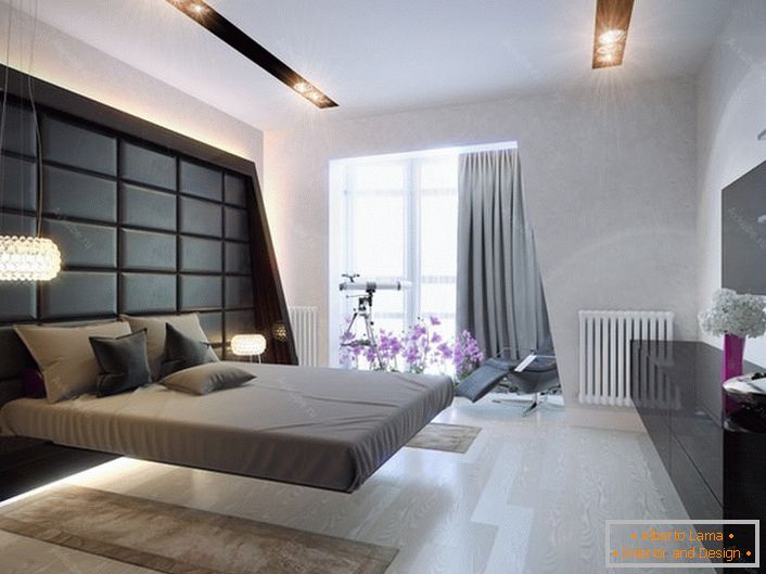 Spacious bedroom in high-tech style. Classic colors in the design of the room: a lot of light, gray and black. Lighting point, multifunctional.