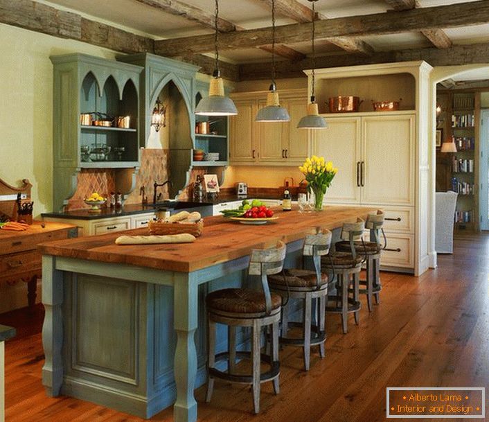 A gentle olive shade harmoniously blends with dark wood floors. In the best traditions of rural country, furniture is selected, which not only looks great, but is functional and practical.