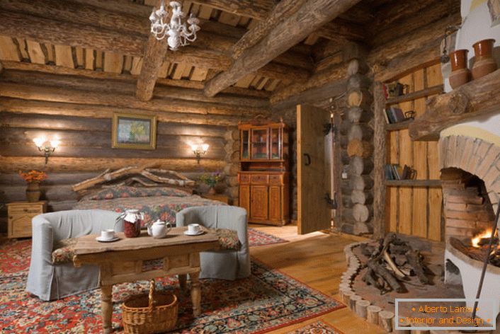 Rustic country with a large bedroom of a country cottage in Scandinavia. In any interior, executed in a rustic style, the fireplace will look harmonious, especially from a brick. 