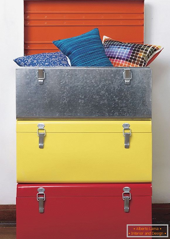 Multicolored pillows in a suitcase