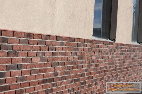 Decorating the facade of the house with panels under the brick - photo