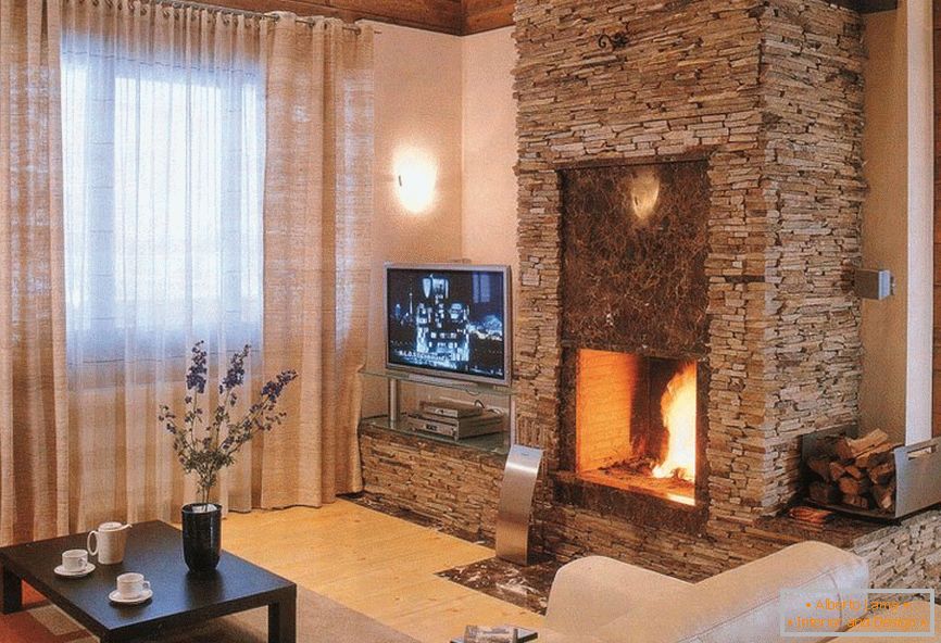 Fireplace made of decorative stone in the living room