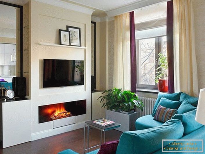Built in the niche of the false wall, the extended bio-fireplace harmonizes with the decor and color of the living room.
