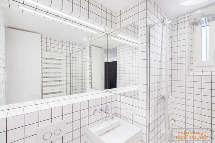 Large mirror with illumination in the bathroom