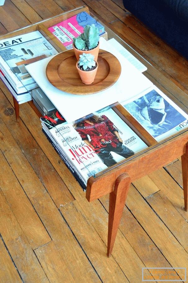 Magazines in the table under the glass