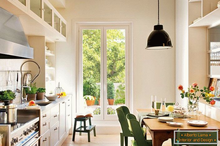 A small kitchen in Scandinavian style in a suburban house of a Moscow businessman. A successful solution for organizing kitchen space.
