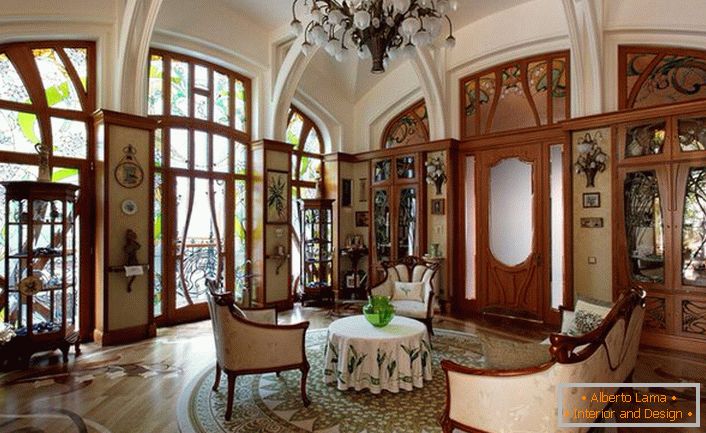 Spacious living room in Art Nouveau style. Exquisite smooth lines, interior decoration with valuable wood species.Spacious living room in Art Nouveau style. Exquisite smooth lines, interior decoration with valuable wood species.