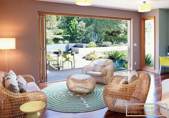 Modern wicker sofas and armchairs on the living room photo