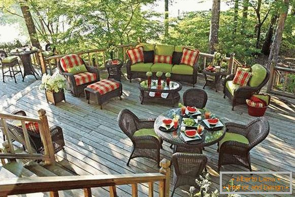 A set of wicker furniture for the veranda: a sofa, armchairs and tables