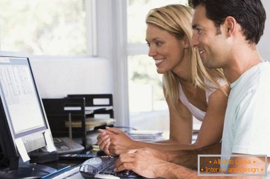 man and women on computer at home