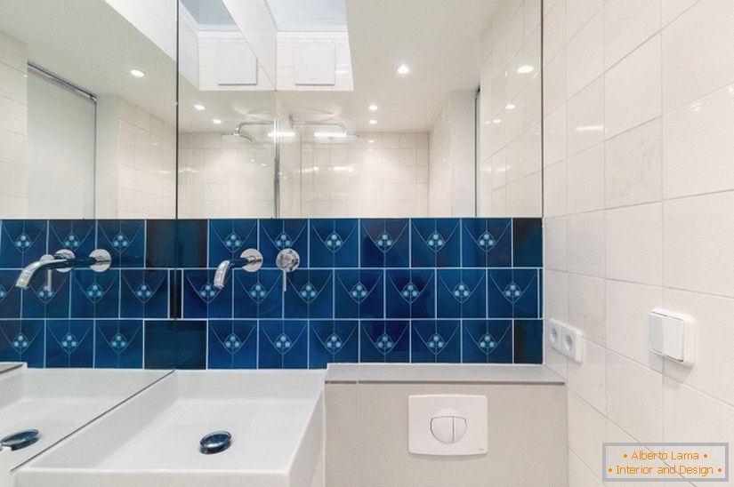 Blue tiles in a white bathroom