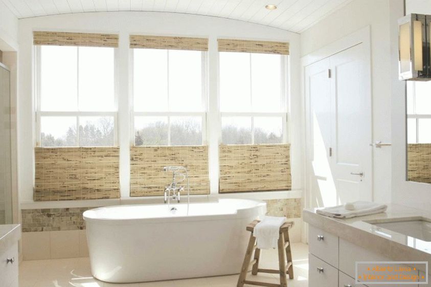 Expensive bathroom with natural materials and large windows