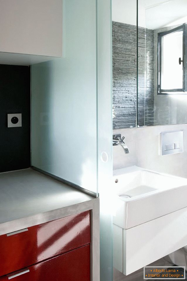 A bathroom of a small studio apartment
