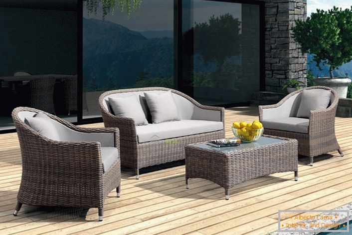 Furniture made of artificial rattan is created for spacious outdoor terraces.