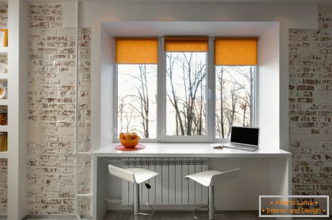 Cabinet at the window in a small studio apartment