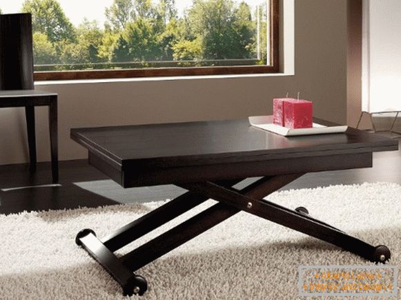 folding brown table with cross legs