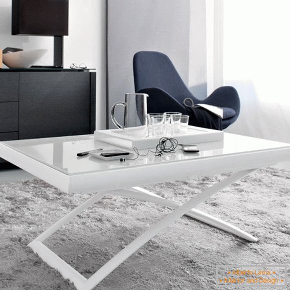 folding table in white with a glass top