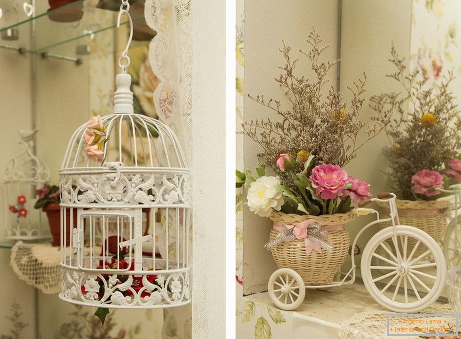 White cage and flowers in a basket on a light cozy kitchen