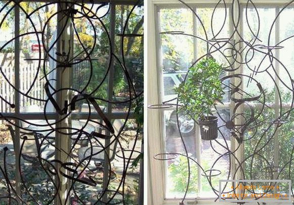 Forged window grilles inside on the windows of the first floor