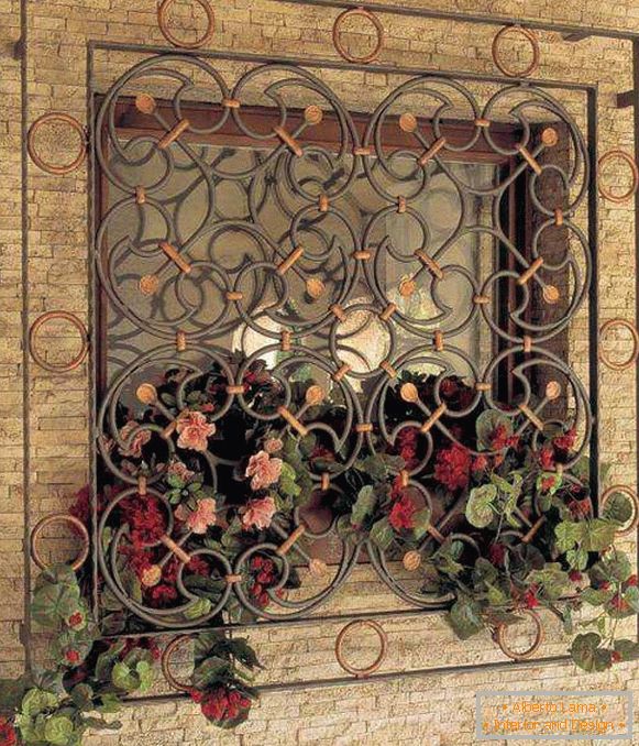 Forged window grilles with the design of a private house