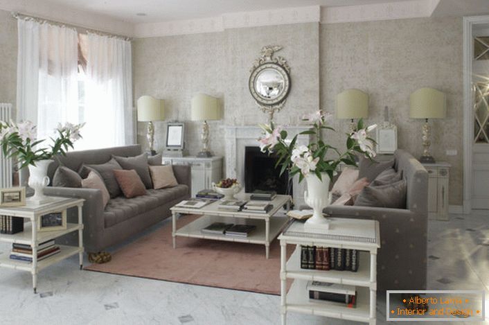 The French-style living room is decorated in light colors. In the room there is a romantic, cozy atmosphere.