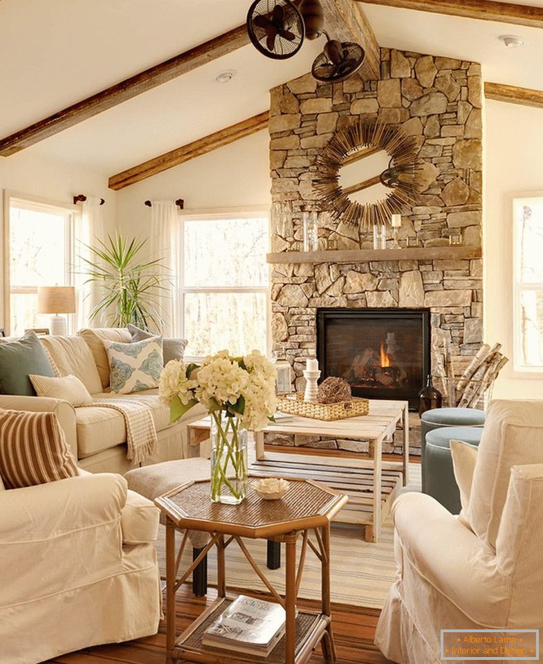Interior of a country house with a fireplace made of natural stone