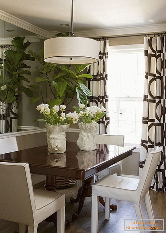 Wooden table in the white dining room
