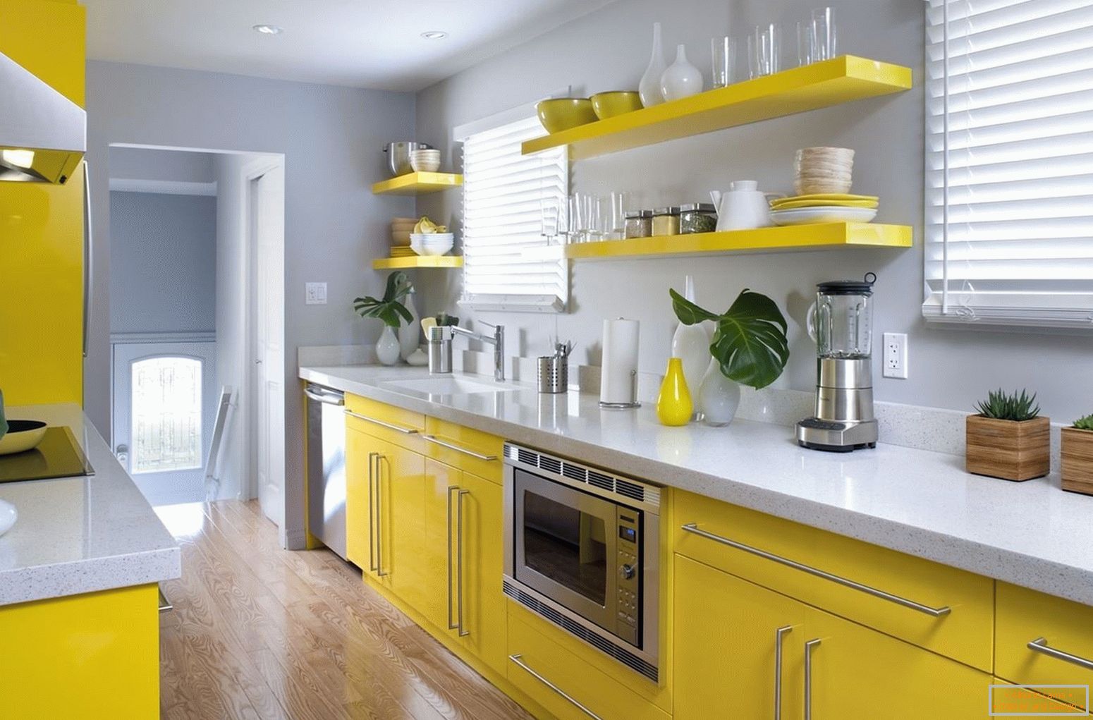 The combination of yellow furniture and gray walls in the kitchen