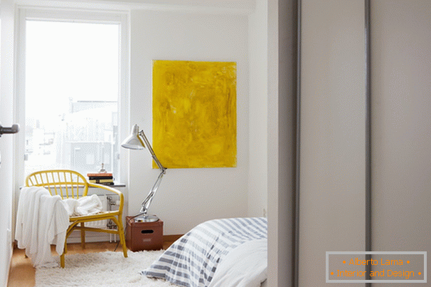 Yellow accents in the white bedroom